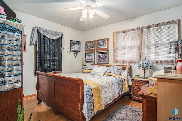 508 E Crawford St, Luverne, MN 56156 - bedroom with wood finished floors and a ceiling fan