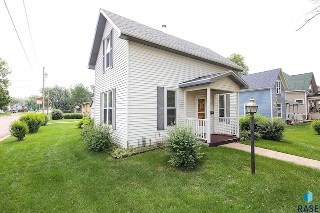 228 N Broadway St, Canton, SD 57013 - view of front facade featuring a front lawn and a shingled roof
