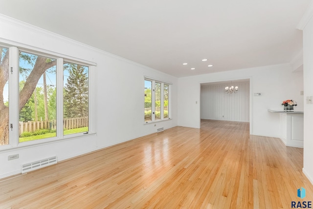 915 E Ridge Rd, Sioux Falls, SD 57105 - unfurnished room featuring a chandelier, ornamental molding, light wood-style flooring, and recessed lighting