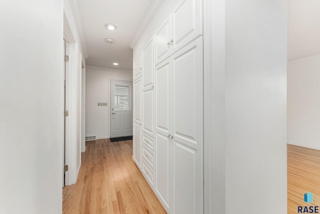915 E Ridge Rd, Sioux Falls, SD 57105 - hallway featuring ornamental molding, light wood-style floors, and recessed lighting