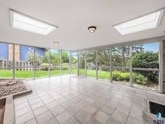 915 E Ridge Rd, Sioux Falls, SD 57105 - unfurnished sunroom featuring a skylight and tile patterned floors