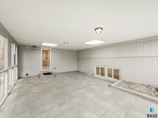 915 E Ridge Rd, Sioux Falls, SD 57105 - spare room with wooden walls