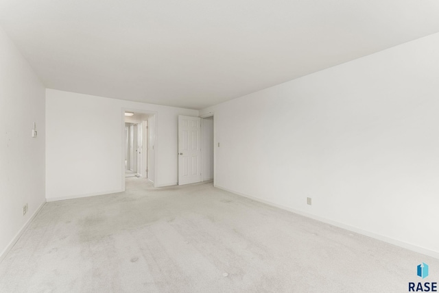 915 E Ridge Rd, Sioux Falls, SD 57105 - spare room with light carpet and baseboards