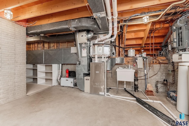 915 E Ridge Rd, Sioux Falls, SD 57105 - unfinished below grade area featuring brick wall, electric panel, and heating unit
