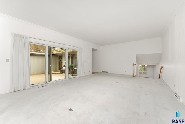 915 E Ridge Rd, Sioux Falls, SD 57105 - unfurnished living room with ornamental molding and carpet flooring