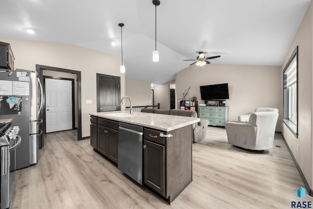 7513 E 49th St, Sioux Falls, SD 57110 - kitchen with stainless steel appliances, lofted ceiling, light wood-style flooring, ceiling fan, and a kitchen island with sink