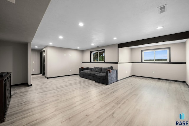 7513 E 49th St, Sioux Falls, SD 57110 - unfurnished living room with light wood finished floors and recessed lighting