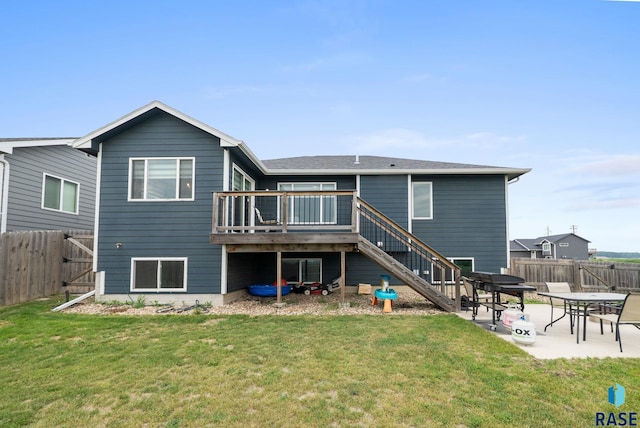 7513 E 49th St, Sioux Falls, SD 57110 - rear view of property featuring a fenced backyard, stairs, a deck, and a patio