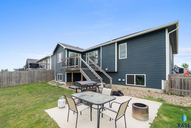 7513 E 49th St, Sioux Falls, SD 57110 - rear view of house featuring a patio area, stairway, a fenced backyard, a wooden deck, and outdoor dining space