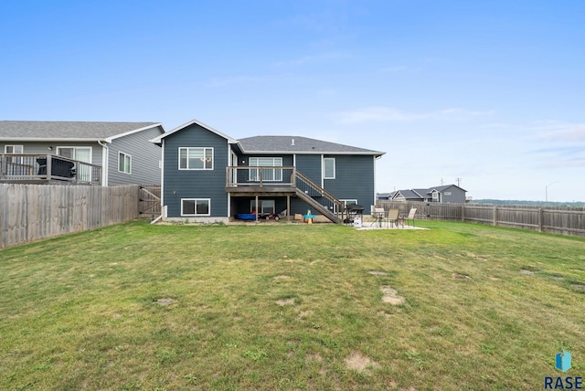 7513 E 49th St, Sioux Falls, SD 57110 - back of property featuring a fenced backyard, stairway, a patio area, and a wooden deck