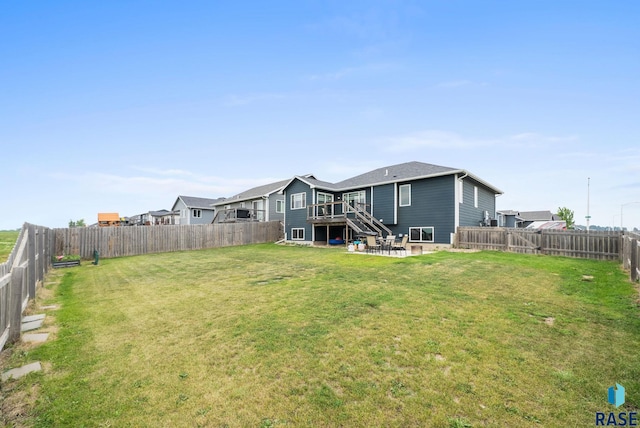 7513 E 49th St, Sioux Falls, SD 57110 - back of house featuring a fenced backyard, stairway, a deck, and a patio