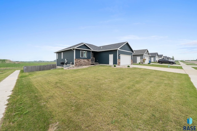 7513 E 49th St, Sioux Falls, SD 57110 - view of front of home with concrete driveway and a garage