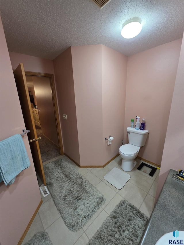 3333 W Ralph Rogers Rd, Sioux Falls, SD 57108 - bathroom featuring a textured ceiling and tile patterned flooring