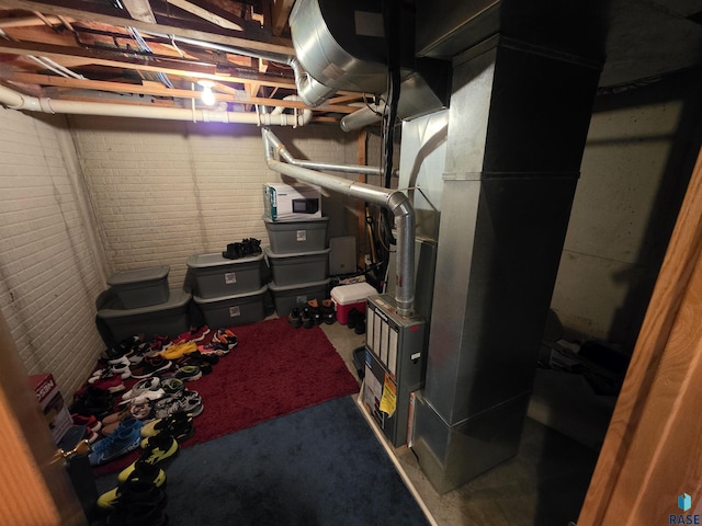 3333 W Ralph Rogers Rd, Sioux Falls, SD 57108 - unfinished below grade area with heating unit and carpet flooring