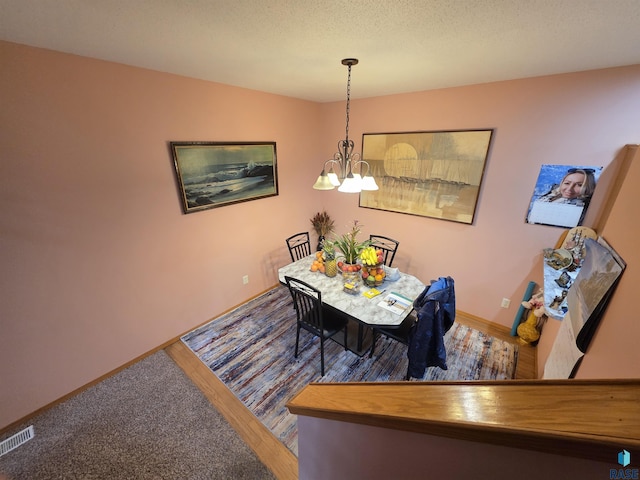 3333 W Ralph Rogers Rd, Sioux Falls, SD 57108 - dining area featuring a chandelier and baseboards