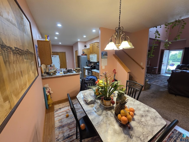 3333 W Ralph Rogers Rd, Sioux Falls, SD 57108 - dining space with recessed lighting and a chandelier