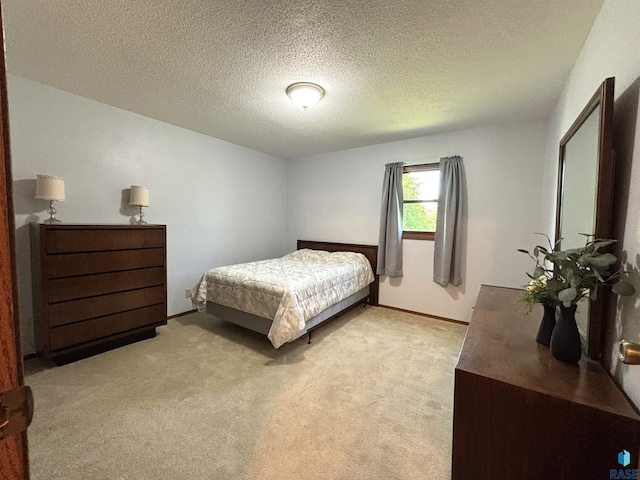 421 E 2nd St, Miller, SD 57362 - bedroom with light carpet and a textured ceiling