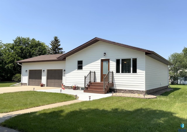 421 E 2nd St, Miller, SD 57362 - view of front of property featuring a garage, a front yard, and concrete driveway