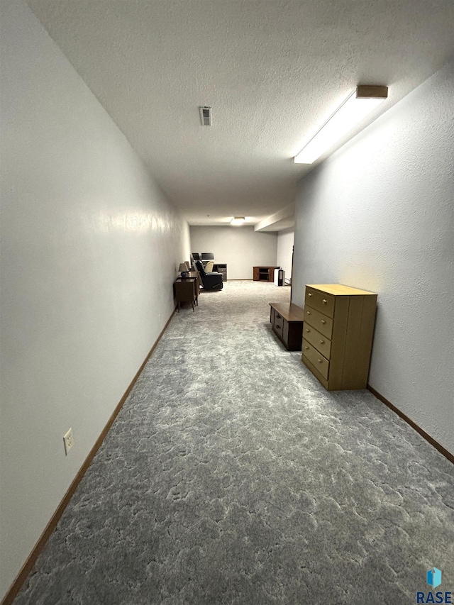 421 E 2nd St, Miller, SD 57362 - living room with carpet flooring and a textured ceiling