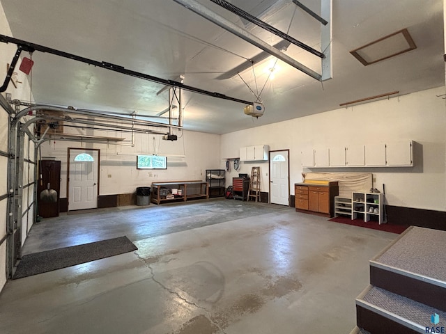 421 E 2nd St, Miller, SD 57362 - garage featuring a garage door opener