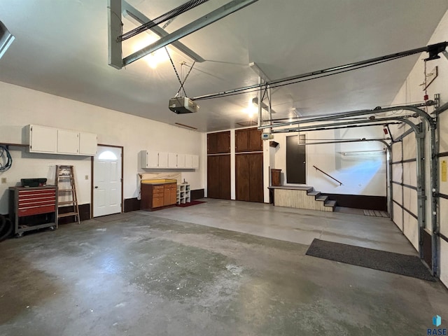 421 E 2nd St, Miller, SD 57362 - garage featuring a garage door opener
