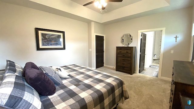 8617 W Bryggen Ct, Sioux Falls, SD 57107 - bedroom featuring light carpet, ensuite bathroom, and ceiling fan