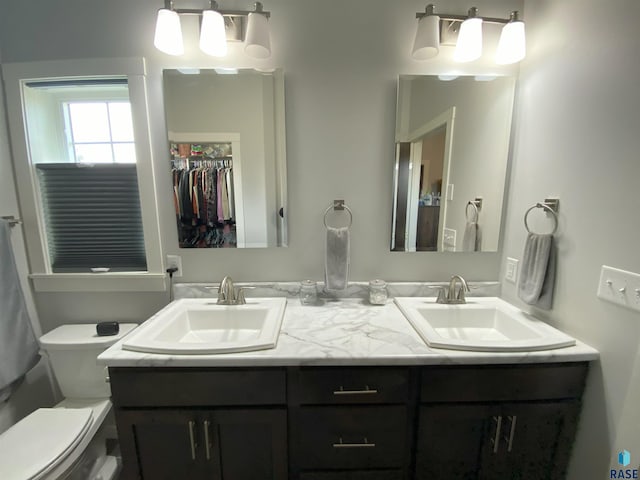 8617 W Bryggen Ct, Sioux Falls, SD 57107 - bathroom featuring toilet and double vanity