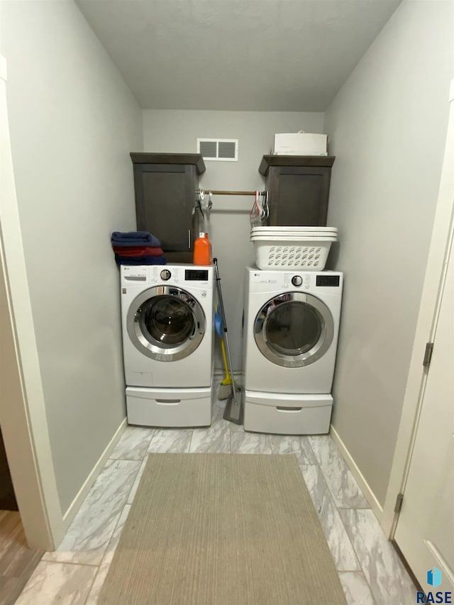 8617 W Bryggen Ct, Sioux Falls, SD 57107 - washroom featuring light marble finish flooring and independent washer and dryer