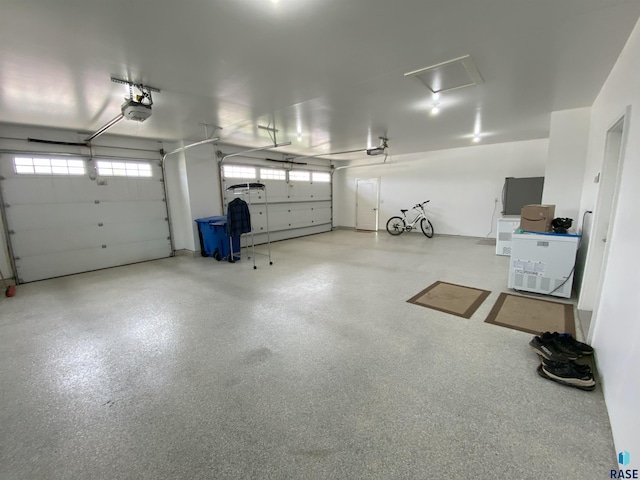 8617 W Bryggen Ct, Sioux Falls, SD 57107 - garage featuring a garage door opener