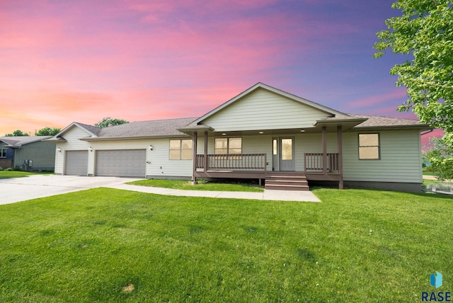 301 W 6th St, Crooks, SD 57020 - ranch-style home featuring concrete driveway, covered porch, a garage, and a lawn