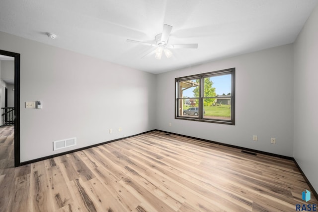 301 W 6th St, Crooks, SD 57020 - unfurnished room featuring ceiling fan, light wood-style floors, and a smoke detector