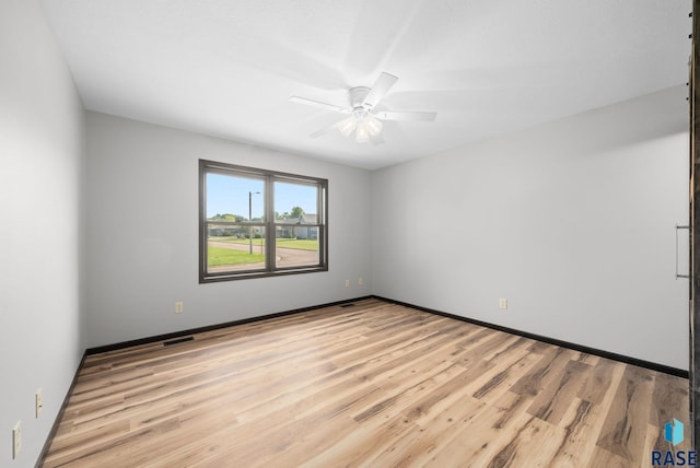 301 W 6th St, Crooks, SD 57020 - empty room with light wood-style floors and ceiling fan