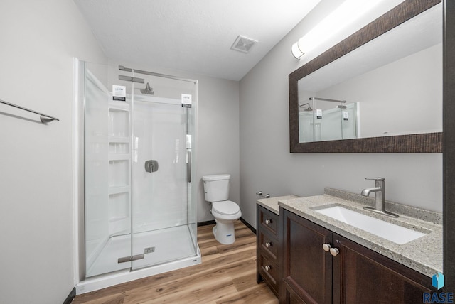 301 W 6th St, Crooks, SD 57020 - full bathroom featuring wood finished floors, a stall shower, and vanity