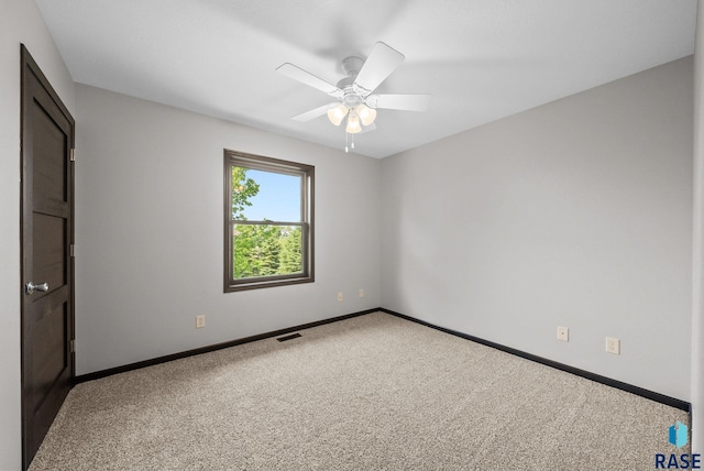 301 W 6th St, Crooks, SD 57020 - empty room featuring carpet floors and a ceiling fan