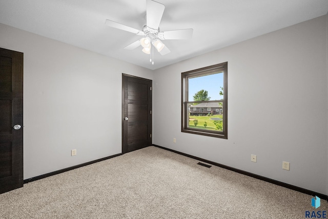 301 W 6th St, Crooks, SD 57020 - unfurnished bedroom with carpet flooring and a ceiling fan