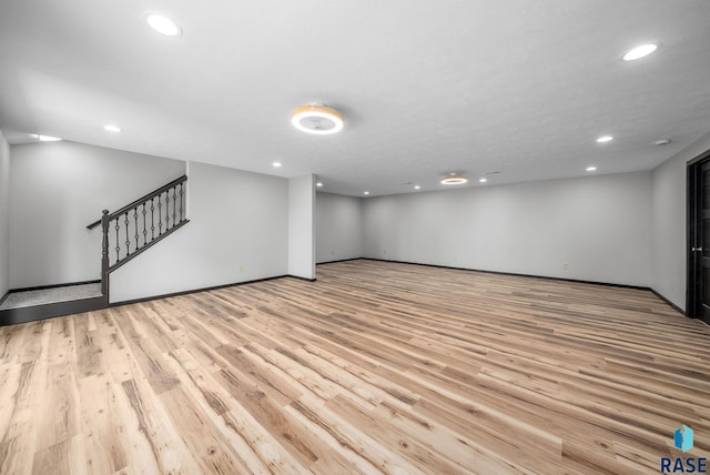 301 W 6th St, Crooks, SD 57020 - finished below grade area featuring recessed lighting, light wood-type flooring, and stairs