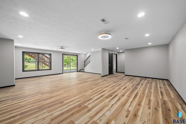 301 W 6th St, Crooks, SD 57020 - spare room with recessed lighting, light wood-style floors, and stairway