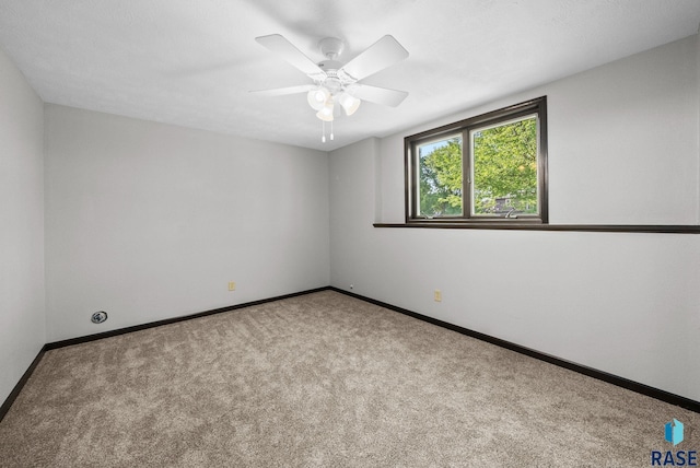 301 W 6th St, Crooks, SD 57020 - carpeted spare room with baseboards and a ceiling fan
