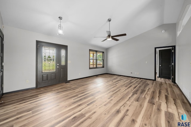 301 W 6th St, Crooks, SD 57020 - unfurnished living room featuring light wood-type flooring, vaulted ceiling, and a ceiling fan