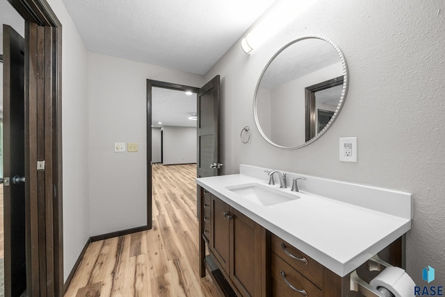 301 W 6th St, Crooks, SD 57020 - bathroom featuring wood finished floors and vanity