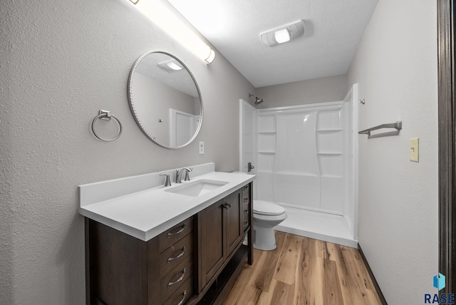301 W 6th St, Crooks, SD 57020 - full bathroom featuring wood finished floors, vanity, and a shower