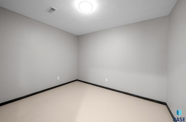 301 W 6th St, Crooks, SD 57020 - spare room featuring baseboards and carpet