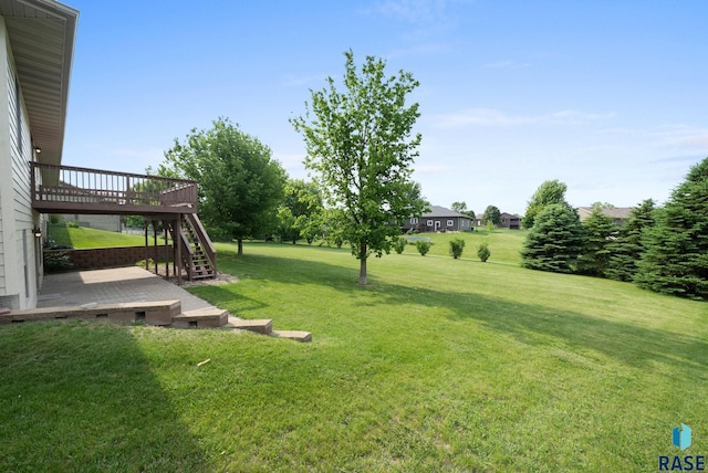301 W 6th St, Crooks, SD 57020 - view of grassy yard with stairway and a wooden deck