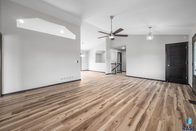 301 W 6th St, Crooks, SD 57020 - unfurnished living room featuring lofted ceiling, wood finished floors, and ceiling fan