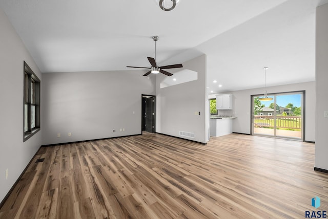 301 W 6th St, Crooks, SD 57020 - unfurnished living room with vaulted ceiling, light wood finished floors, a ceiling fan, and recessed lighting