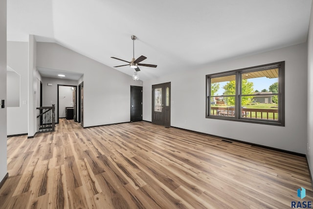 301 W 6th St, Crooks, SD 57020 - unfurnished living room with ceiling fan, light wood-type flooring, and vaulted ceiling