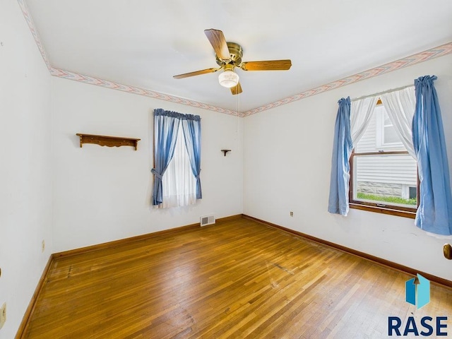 1721 W 11th St, Sioux Falls, SD 57104 - empty room featuring hardwood / wood-style floors and a ceiling fan