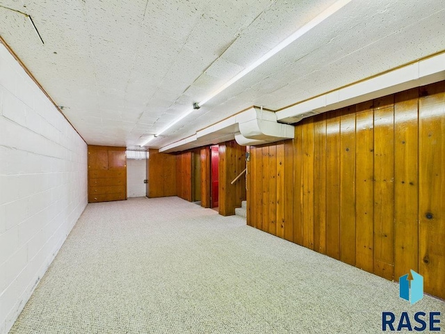 1721 W 11th St, Sioux Falls, SD 57104 - finished basement featuring concrete block wall, stairway, wooden walls, and carpet