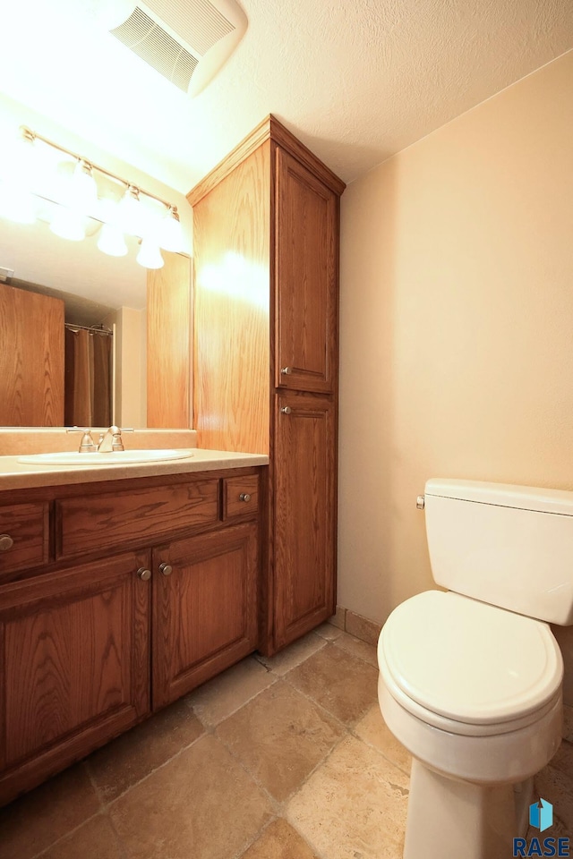 429 S Elm St, Lennox, SD 57039 - bathroom featuring toilet and vanity
