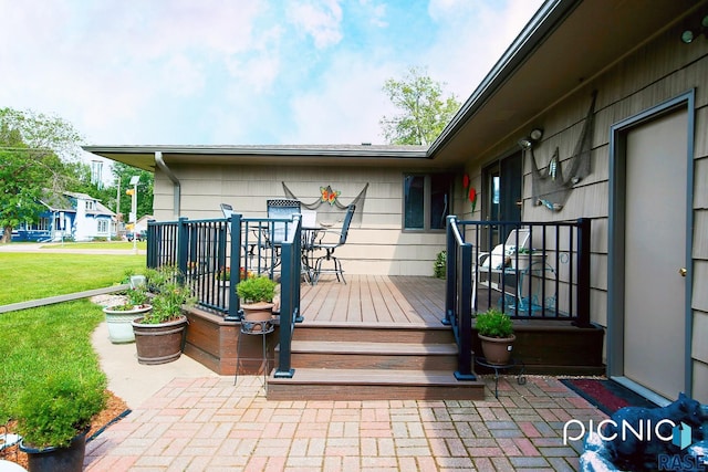 429 S Elm St, Lennox, SD 57039 - wooden terrace featuring a yard
